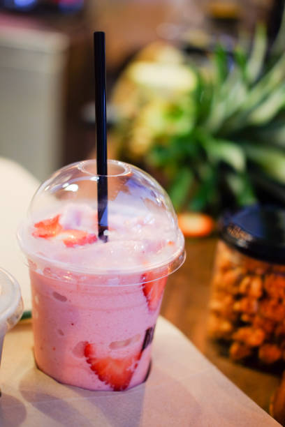 Strawberry smoothies in a glass cup